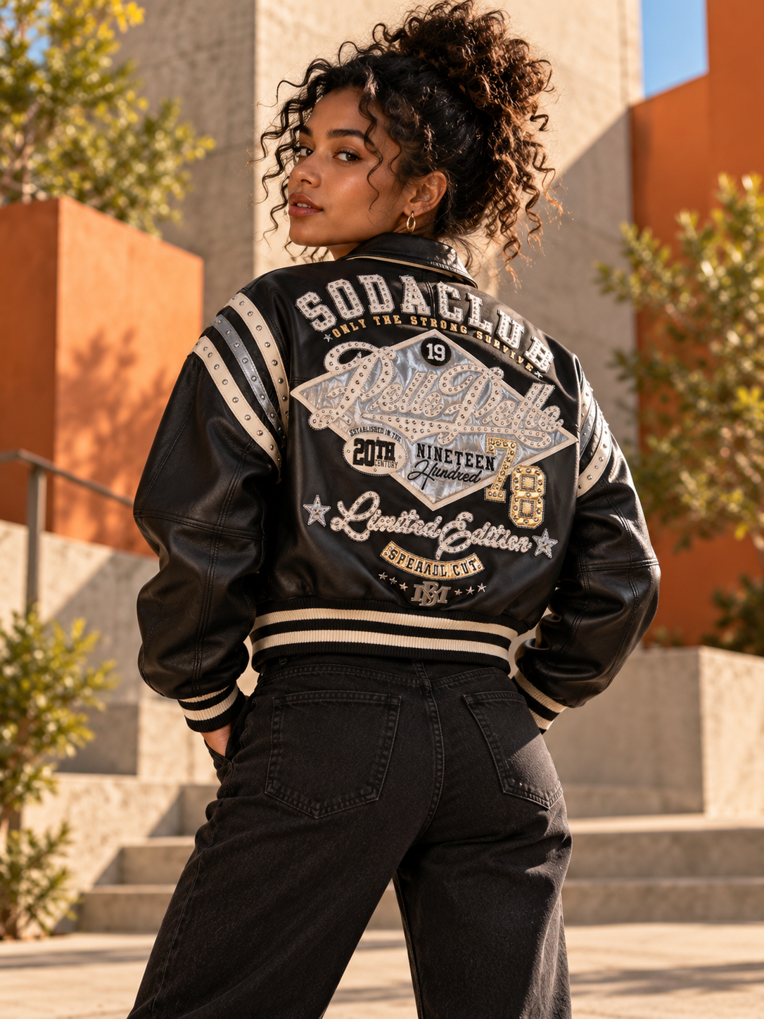 Model wearing Moda X's black Pelle Pelle Only the Strong women's jacket